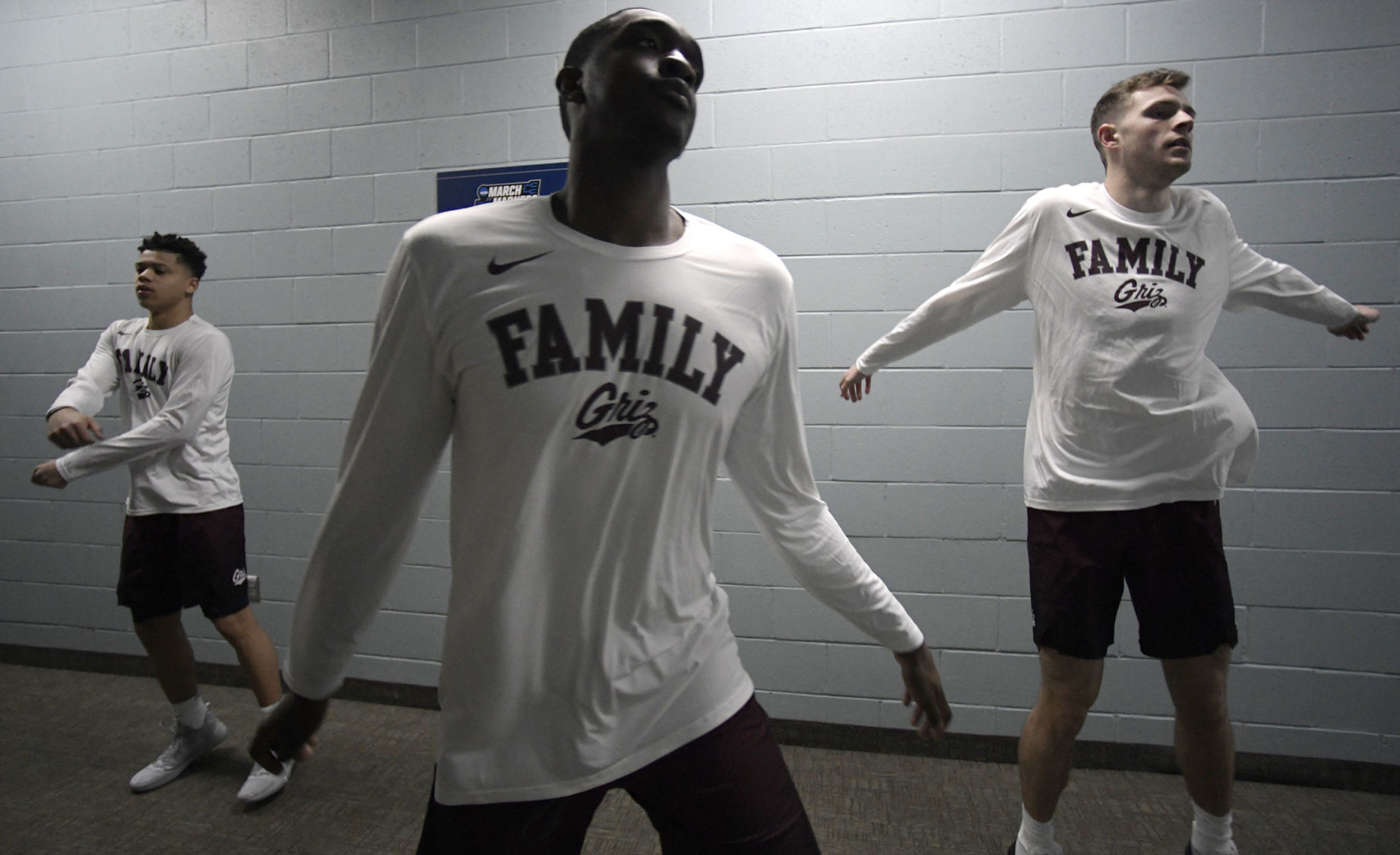 Donaven Dorsey, center, warms up with Mack Anderson